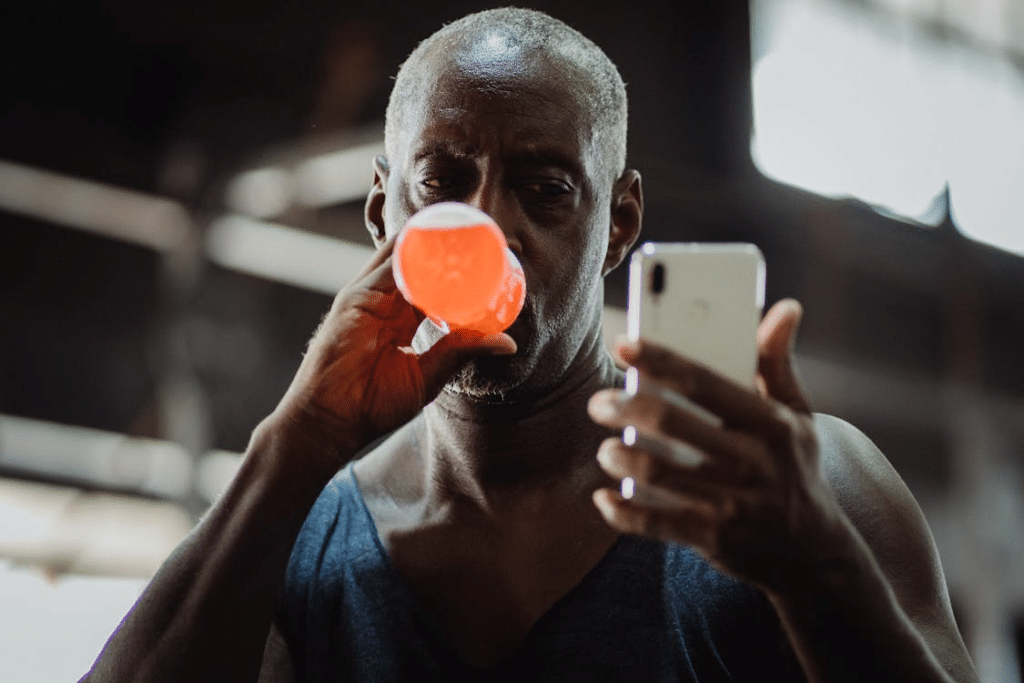 A man drinking an energy drink