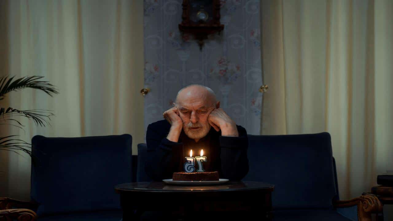 A man celebrating his birthday alone