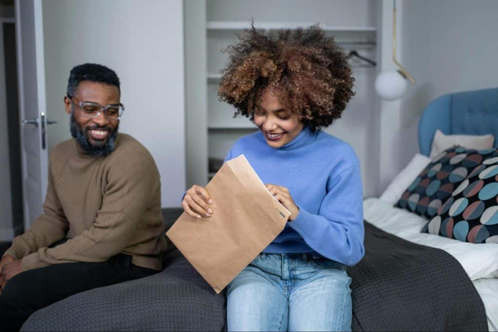 A man just smiling at the woman