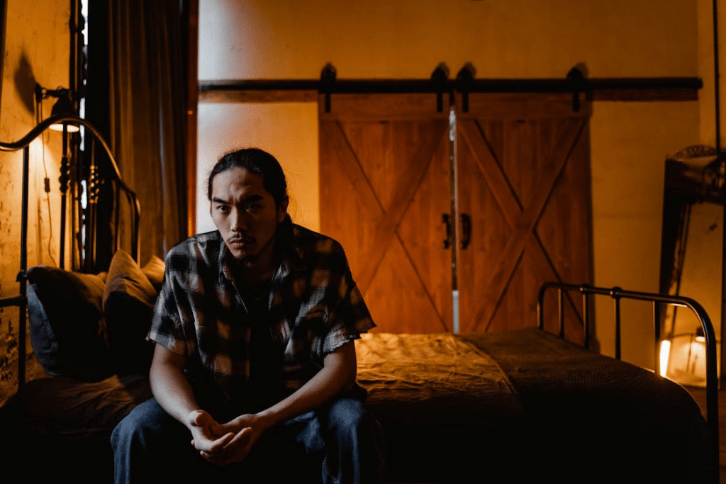 A Sad Man Sitting on the Bed