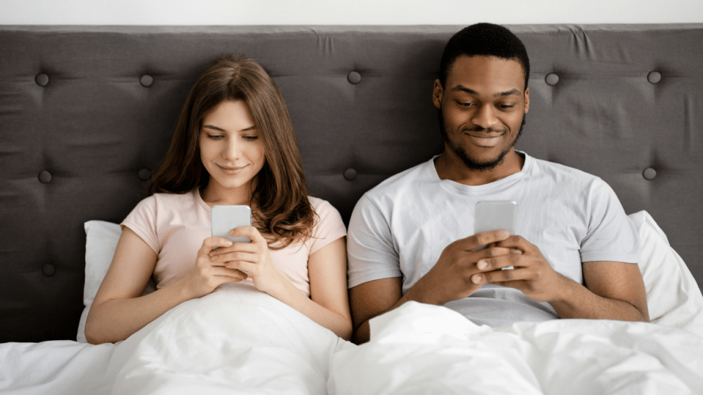 A couple busy with their own phones