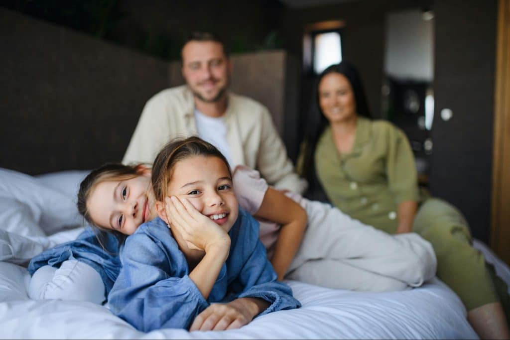A man and woman looking at their children