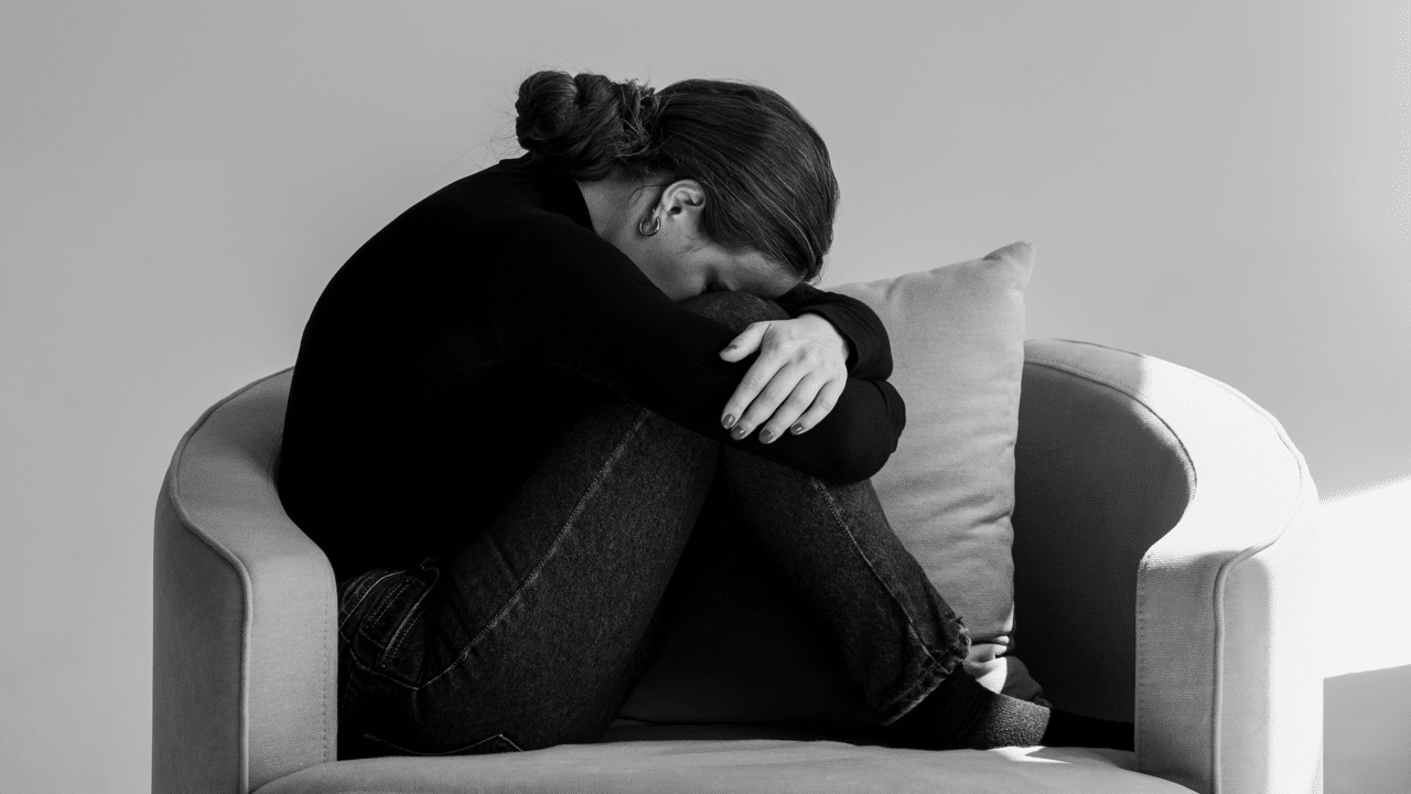 A woman looking upset at home 