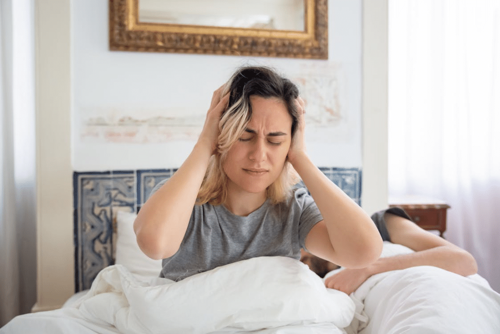 A woman frustrated in bed