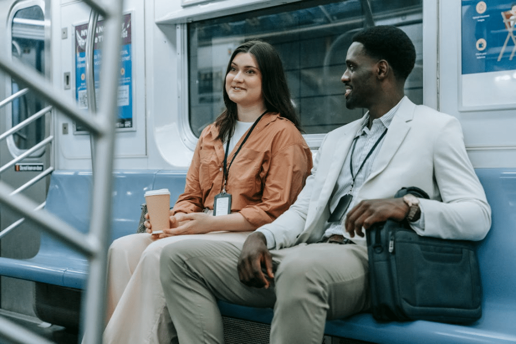 A man and a woman sitting on the train