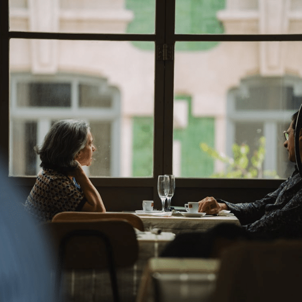 A man and a woman sitting at the table