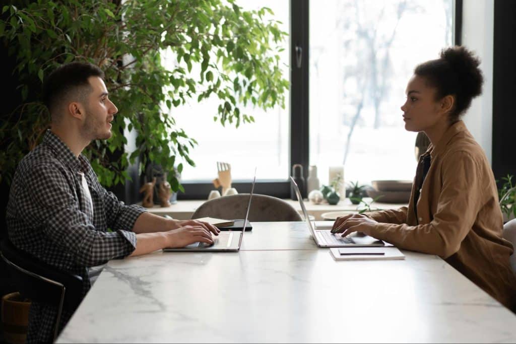 A man and woman facing each other