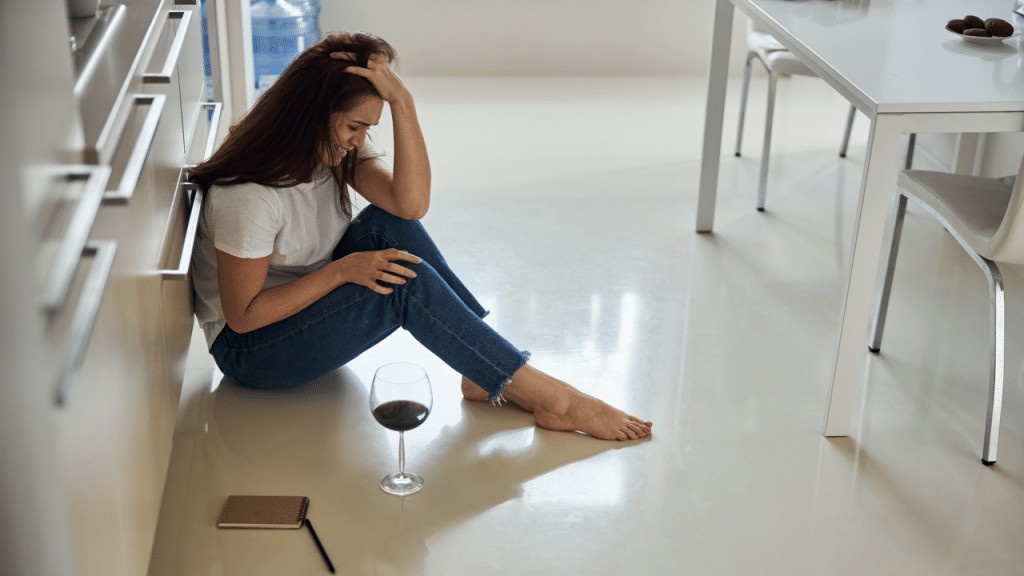 A woman crying ont he floor