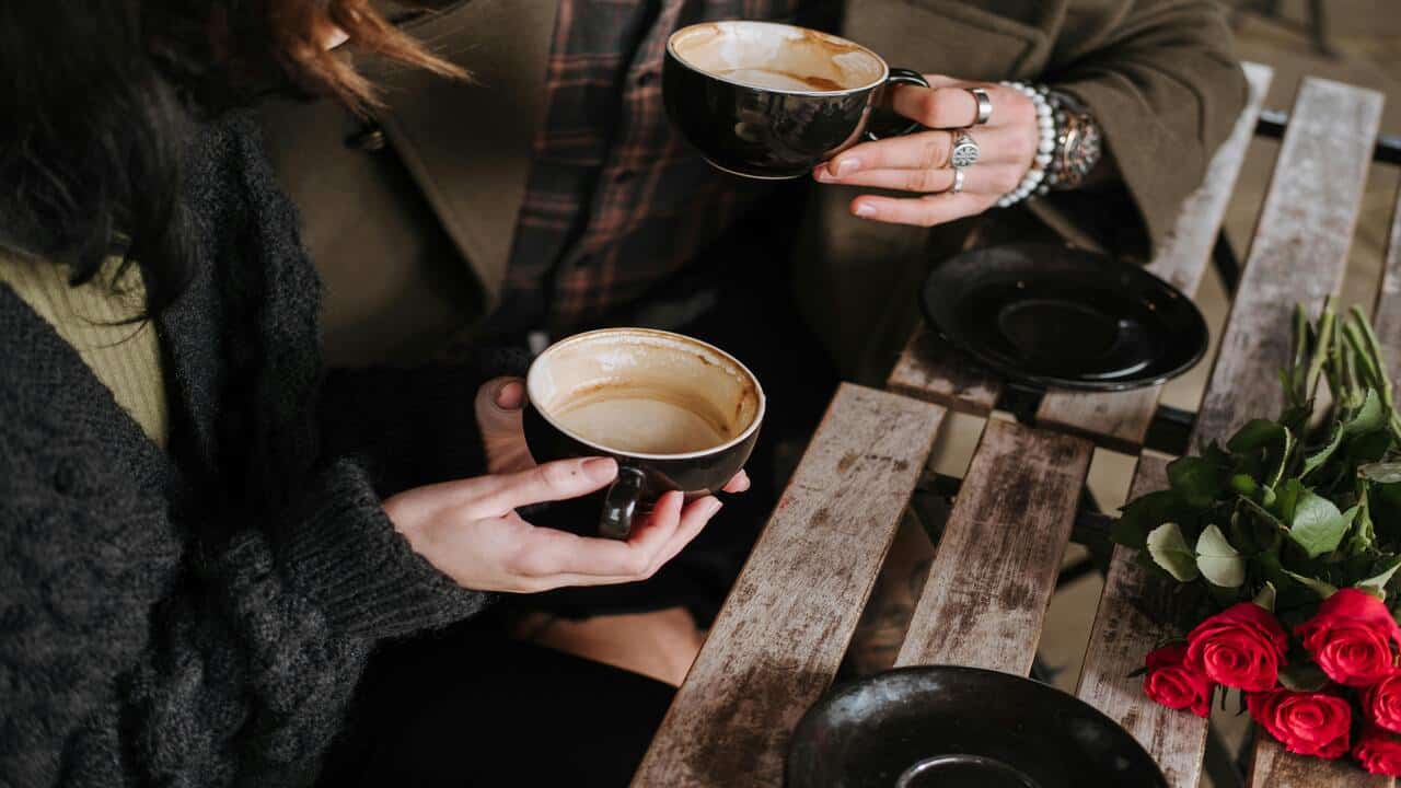 A couple about to finish their coffee
