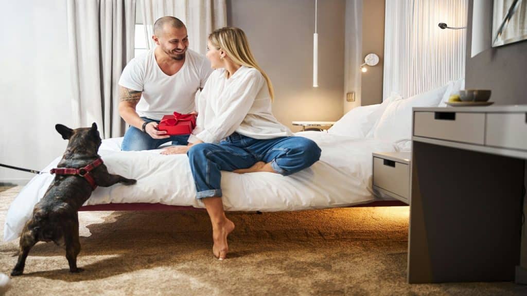 A man giving his wife a gift