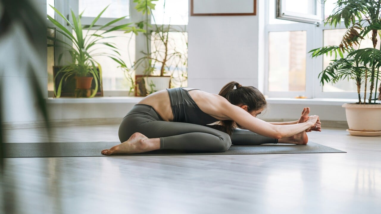 A woman doing yoga at home 
