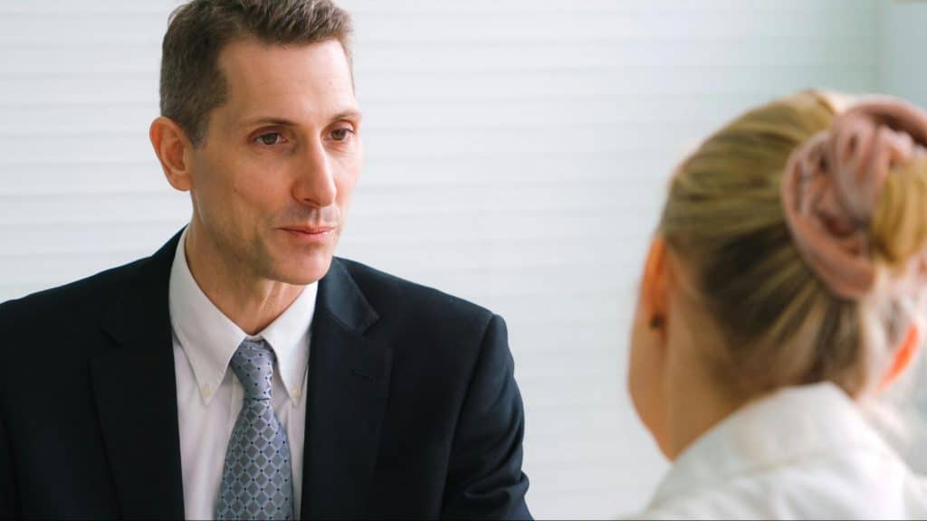 A man looking at the woman