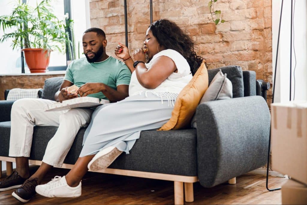 A man and woman at the couch