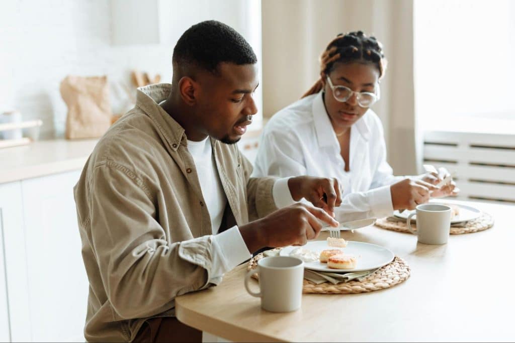 A man and woman having breakfast together