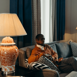 A Man Sitting on a Sofa