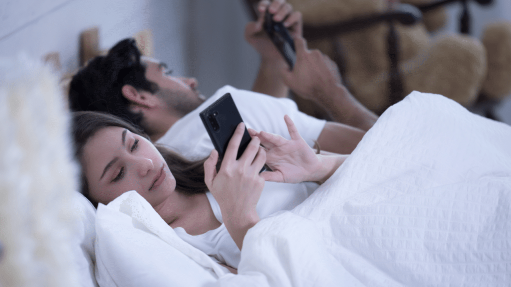 A couple busy with their phones
