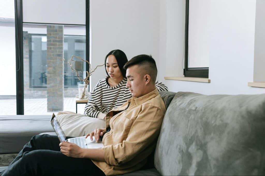 A man and woman at the couch