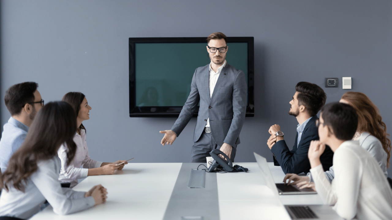 A man leading a business meeting