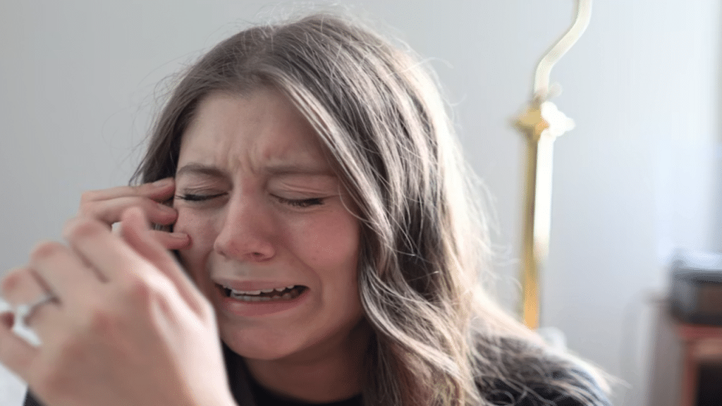 A woman crying at home