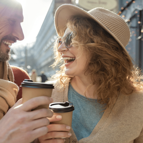 A couple having coffee outdoors