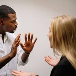 A man and a woman arguing intensely.