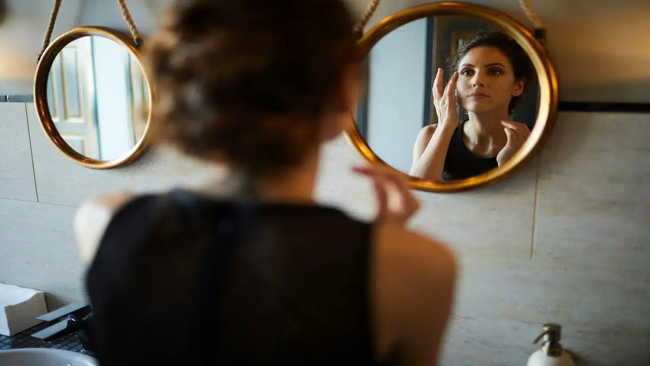 A woman fixing her makeup 