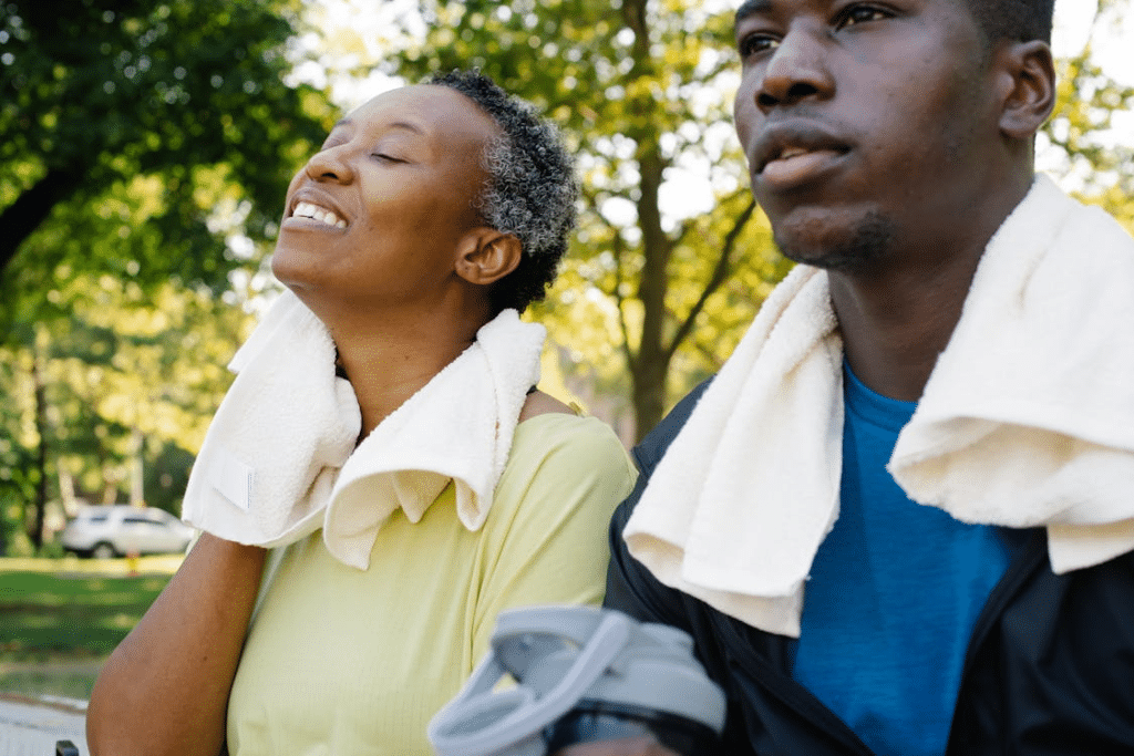 A man and a woman resting after exercising