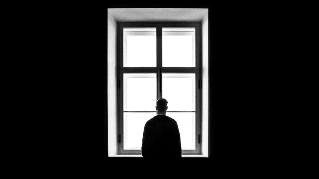 A man looking out the window