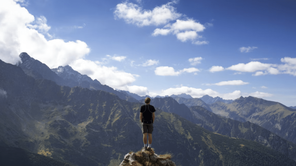 A man on top of a mountain