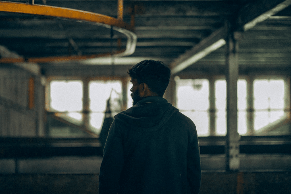 A man standing and looking at the side