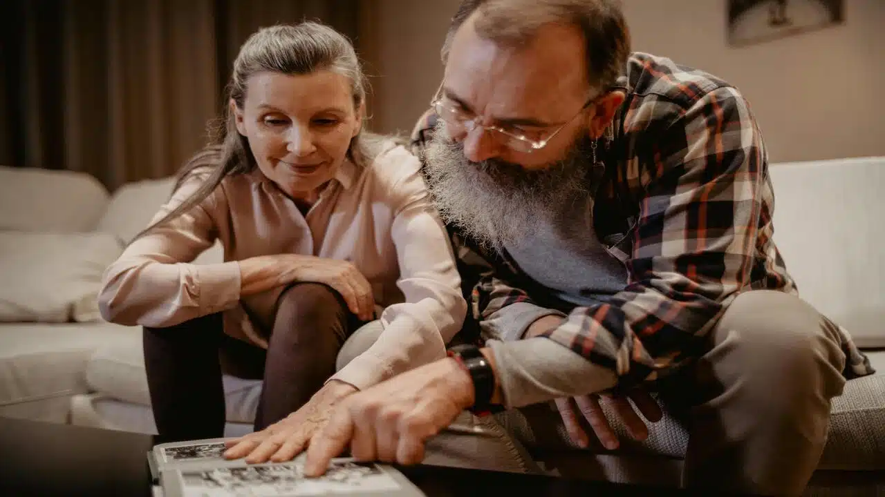 A couple looking at old photographs 
