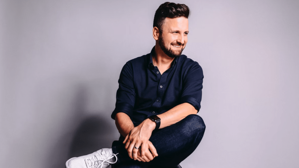 A man smiling at a photoshoot