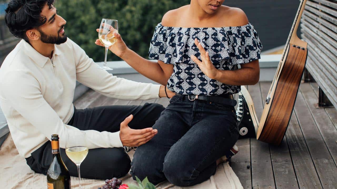 A woman clearly denying a man’s romantic gesture.