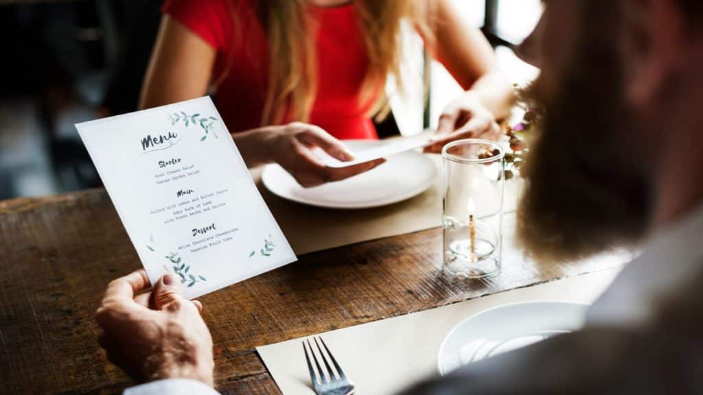 A couple looking at the menu