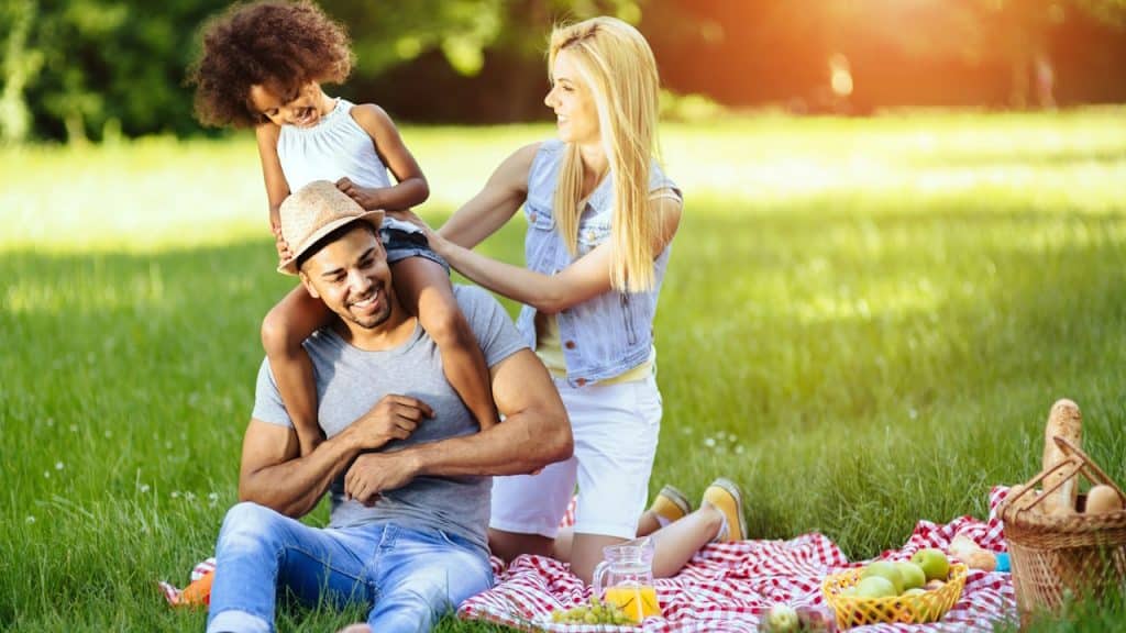 A happy family on a picnic at daytime.