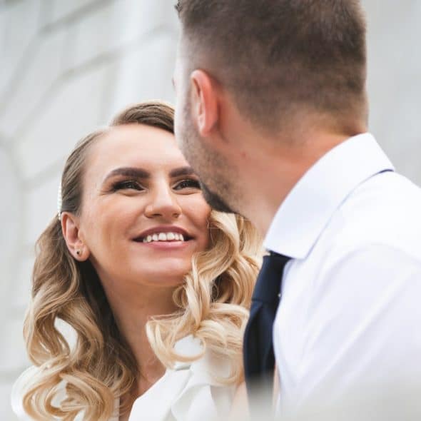 A woman smiling at a man.