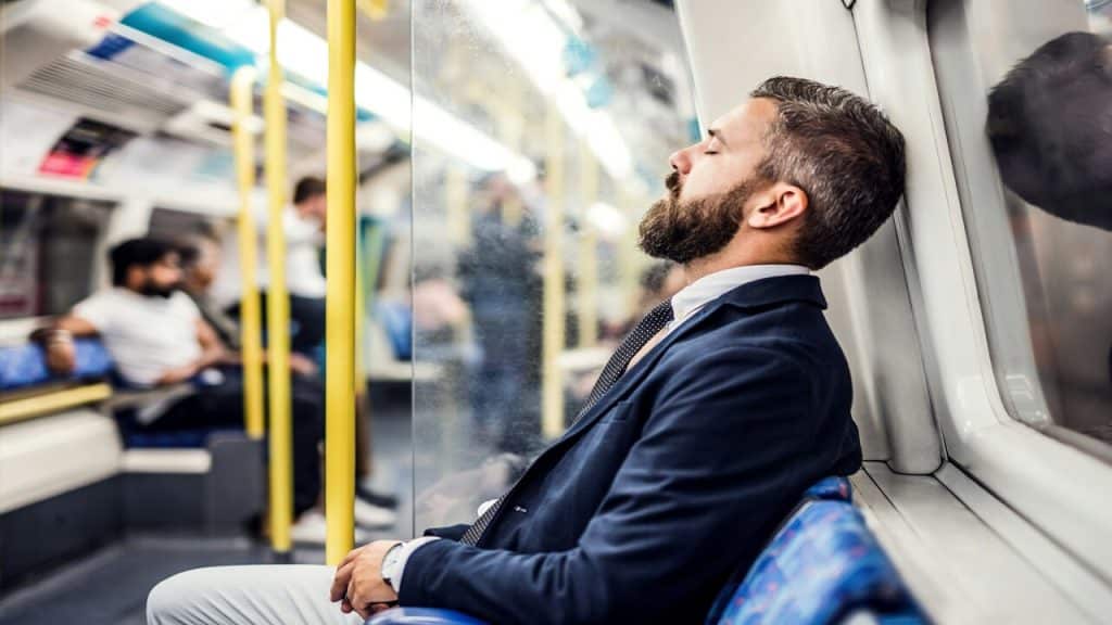 A man sleeping in the subway