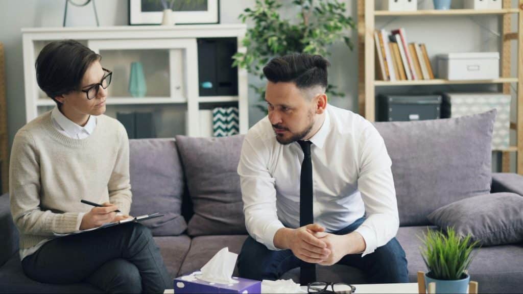 A man talking to a woman