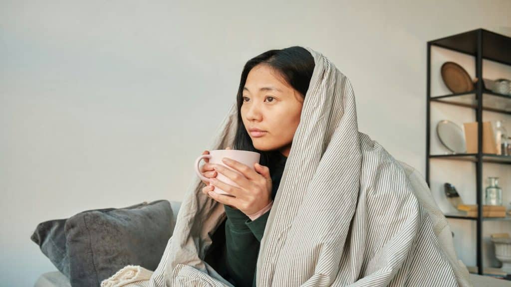 A woman looking tired at home