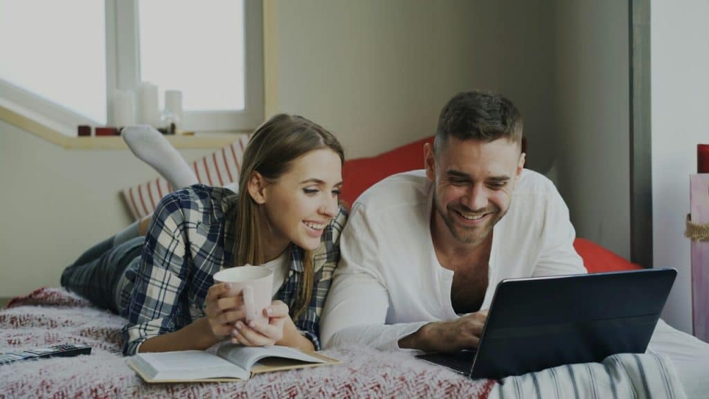 A couple looking at a laptop together