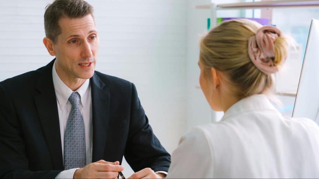 A man trying to talk calmly towards woman