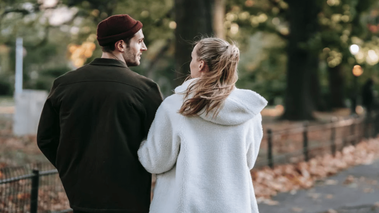 A couple talking while walking