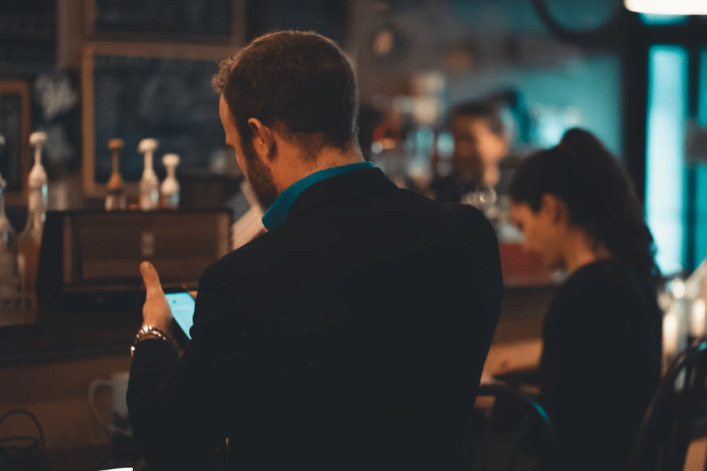 Side View of Man With His Hand on His Mouth