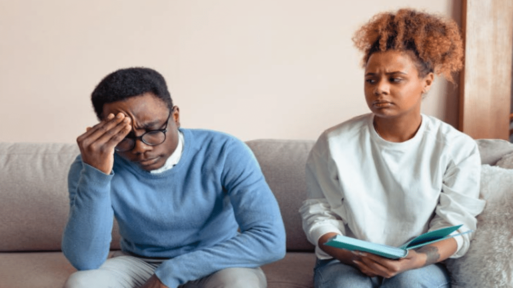 A woman looking upset at her husband