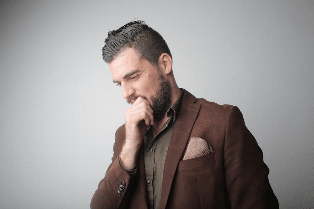 A man in brown quote thinking