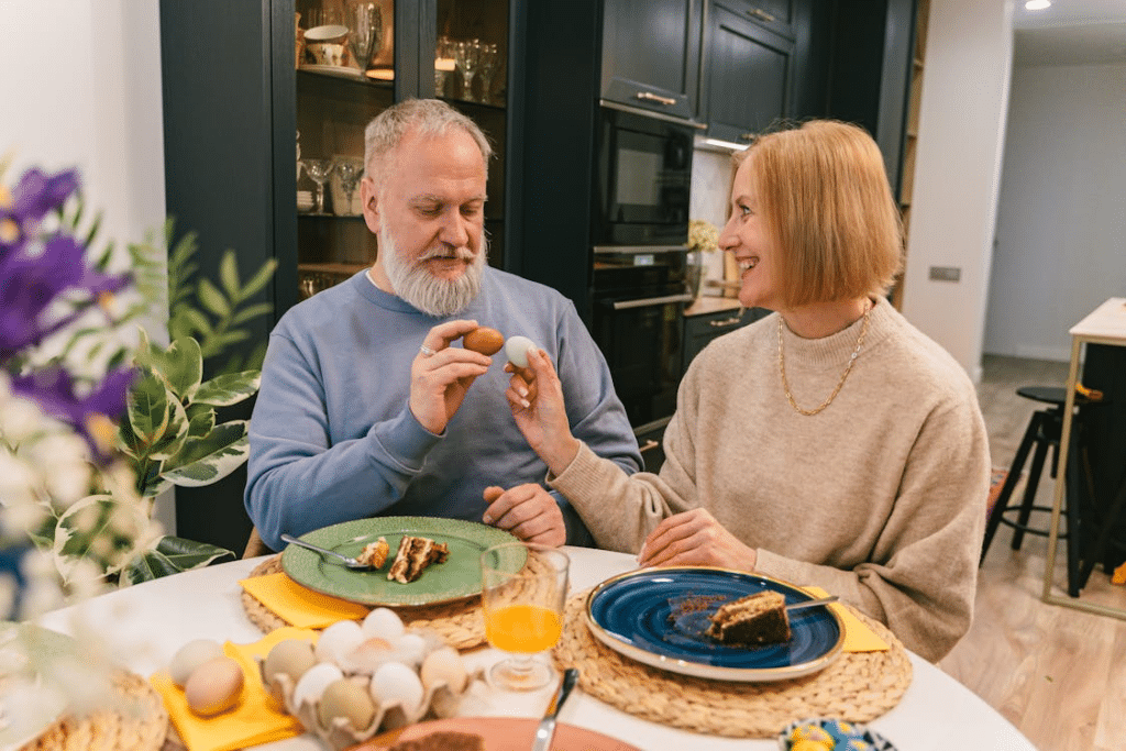 Smiling Elderly Couple Holding Easter Eggs