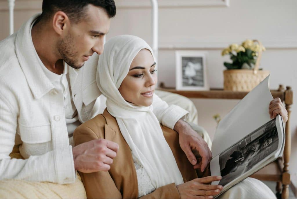 A man and woman reading a book