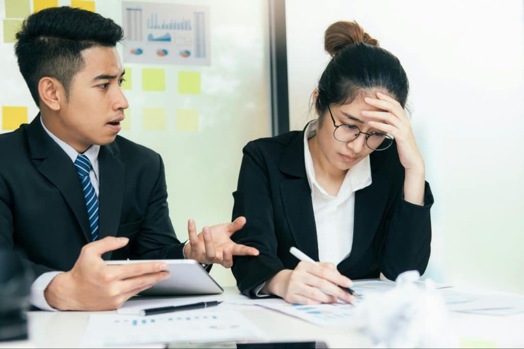 A man questioning a woman