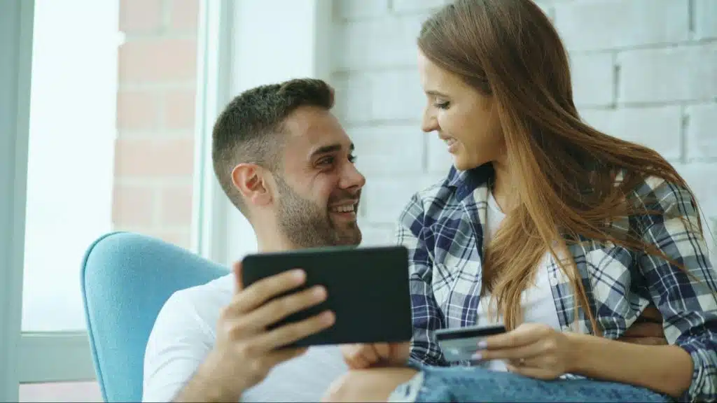 A man and woman smiling at each other