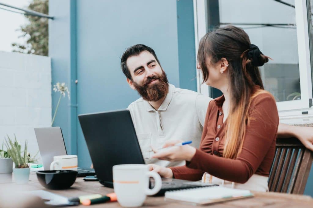 A man and woman looking at each other